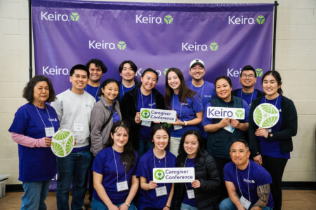 group of volunteers with Keiro backdrop