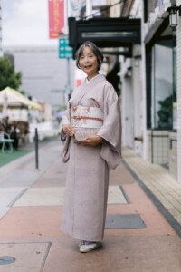 woman in kimono holding clutch
