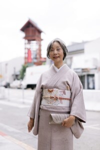 woman in kimono holding clutch