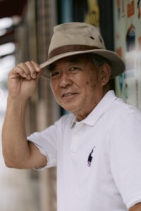 man tipping his hat