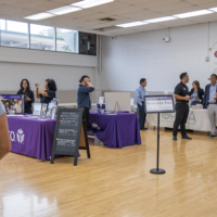 room of people with booths