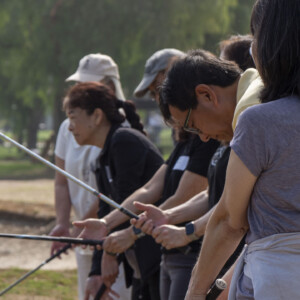 a group of people holding their golf clubs