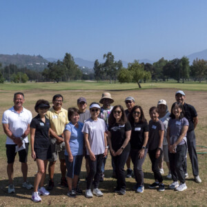 group of people on a golf course