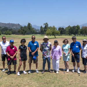 a group of people on a golf course