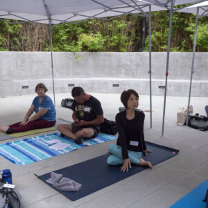 a groupe of people sitting on yoga mats