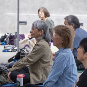 a group of people sitting and listening