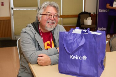 man smiling with Keiro bag