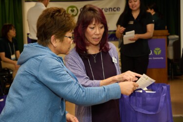 two people looking at a paper