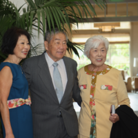 group of three people smiling