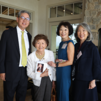 group of four people smiling