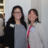 Two women smiling at camera