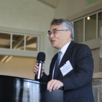 Kosei Murota talking into pic at podium