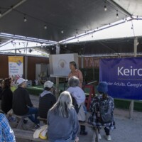 a man talking to a group of people