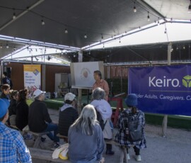 a man talking to a group of people