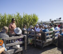 a group of people on a tractor wagon