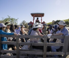 a group of people on a tractor wagon