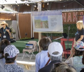 two woman giving a presentation to a group