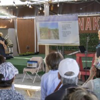 two woman giving a presentation to a group