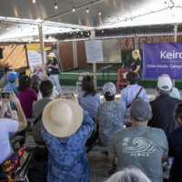 two woman giving a presentation to a group
