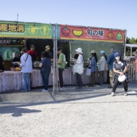people waiting in front of a booth