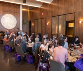 group of people sitting down in a restaurant