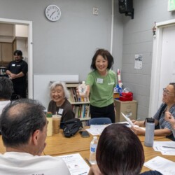 a woman in green posing with koji