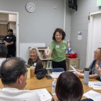 a woman in green posing with koji