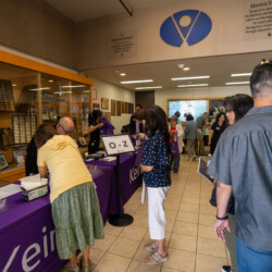 a group of people waiting at registration table