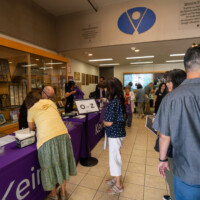 a group of people waiting at registration table