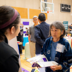 a woman in blue holding a publication