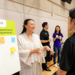 Sarah Fukui talking with people
