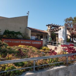 front of South Coast Botanic Garden building and sign