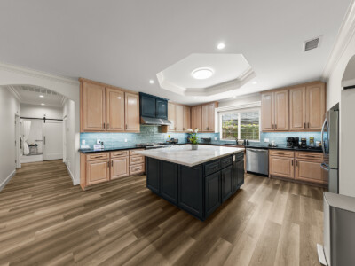 kitchen with blue tile and black table island