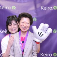 two women posing at photo booth