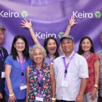 group of people posing at photo booth