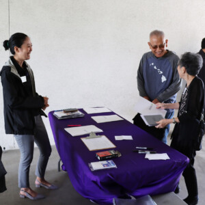 people gathered at a registration table