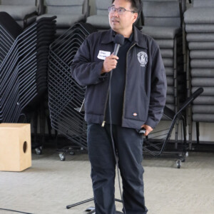 man talking into microphone