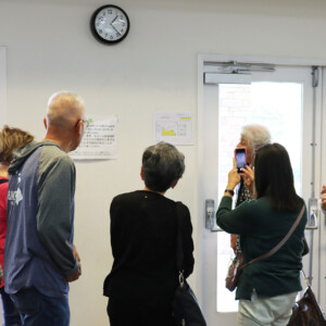 group of people looking at emergency exit plan