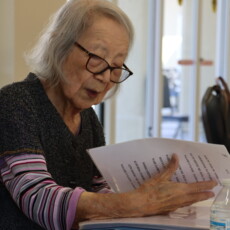 woman singing while reading