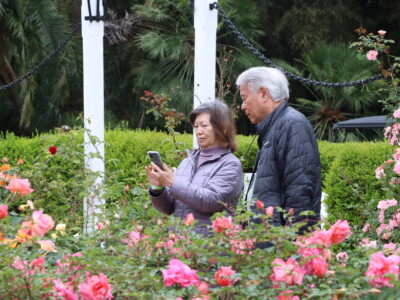 a man and a woman taking a photo