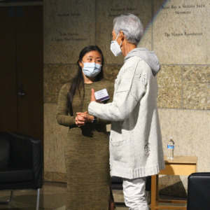 Dr. Komatsu talking with attendee