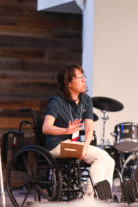 woman showing wheel chair demonstration