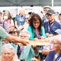 M PALMA PHOTO 2025 crowd of people getting mochi from a tray