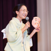 M PALMA PHOTO 2025 woman on stage in kimono holding mask