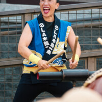 M PALMA PHOTO 2025 woman smiling playing taiko