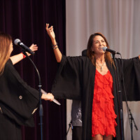 M PALMA PHOTO 2025 woman in red dress singing on stage