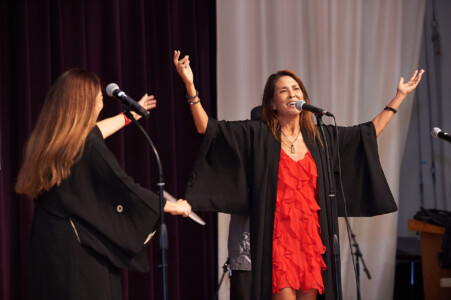 M PALMA PHOTO 2025 woman in red dress singing on stage