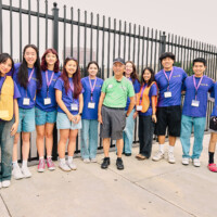 M PALMA PHOTO 2025 group of volunteers wearing purple shirts, one Keiro staff member in greens shirt