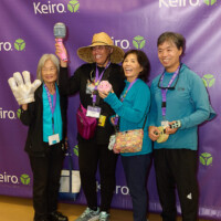 M PALMA PHOTO 2025 four people posing with photo booth props