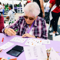 M PALMA PHOTO 2025 woman stamping a greeting card